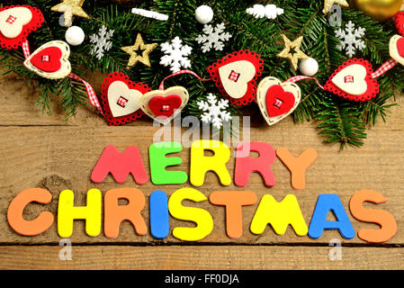 Merry Christmas word on wooden table Stock Photo