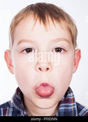 Boy showing a tongue Stock Photo