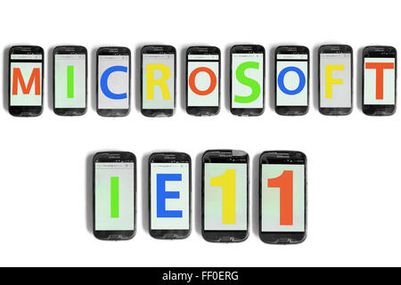 Microsoft IE11 written on the screens of smartphones photographed against a white background. Stock Photo