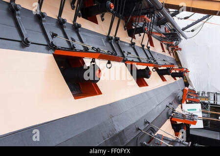 Gun ports on HMS Victory, the historic Royal Navy vessel which headed the victory of British naval forces at  Trafalgar Stock Photo