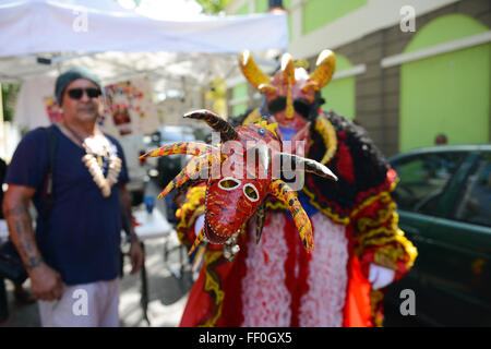 Traditional masked cultural figure VEJIGANTE during the carnival in Ponce. Puerto Rico. US territory. February 2016 Stock Photo