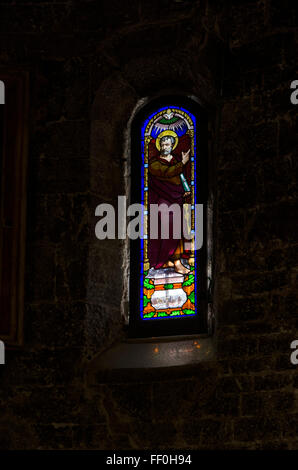 Stained glass in a Italian church Stock Photo