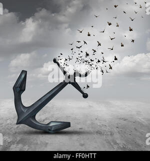 Letting go psychology concept as a heavy anchor transforming into a flying group of birds as a motivational metaphor for liberation and leaving a life or business burden behind. Stock Photo