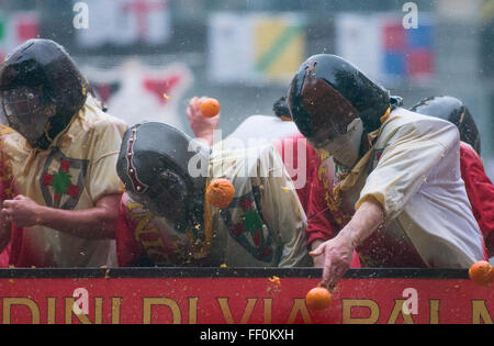 The traditional 'battle of the oranges' held during the Ivrea Carnival ...