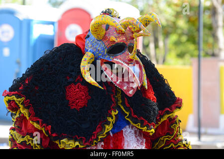 Traditional masked cultural figure VEJIGANTE during the carnival in Ponce. Puerto Rico. US territory. February 2016 Stock Photo