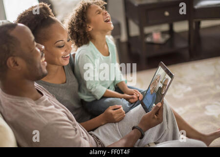 Family video chatting with digital tablet Stock Photo