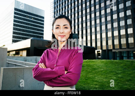 Asian businesswoman standing outdoors Stock Photo