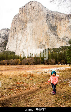 Caucasian baby girl walking in Yosemite National Park, California, United States Stock Photo