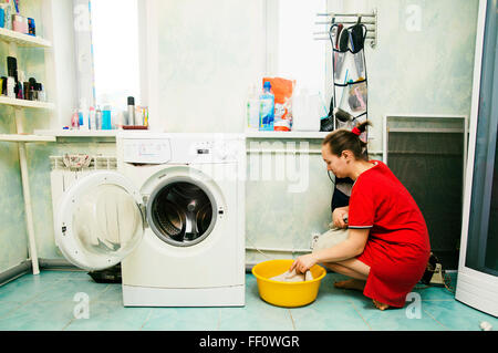 Caucasian woman hand-washing laundry Stock Photo