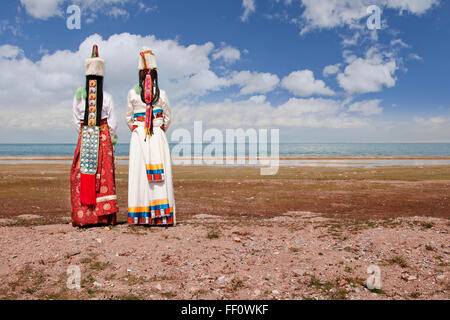 Rear view of women in traditional clothing in remote landscape Stock Photo