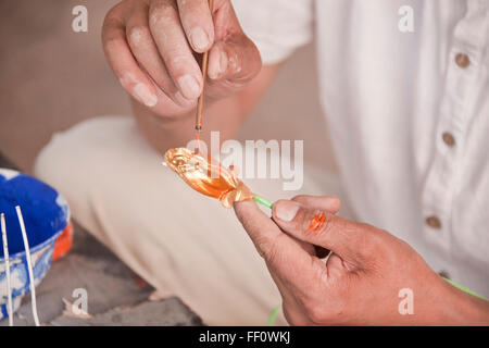 Close up of artist painting glass ornament Stock Photo