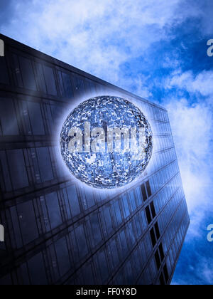 Low angle view of orb floating near highrise building Stock Photo