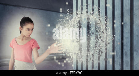 Mixed race girl touching pixelated sphere Stock Photo