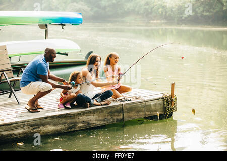 Family fishing in lake Stock Photo