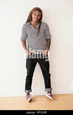 Mixed race man smiling Stock Photo