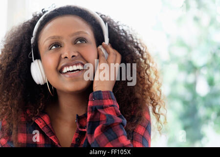 Black woman listening to headphones Stock Photo