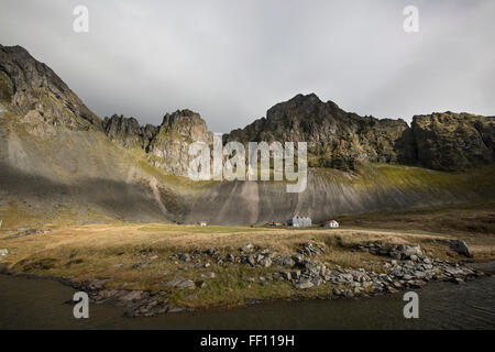 Rocky cliffs in remote field Stock Photo