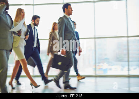 Modern business people walking to work Stock Photo