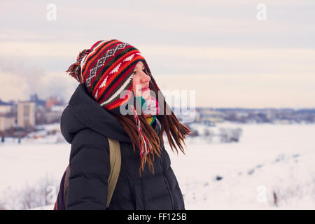 Caucasian woman admiring snowy landscape