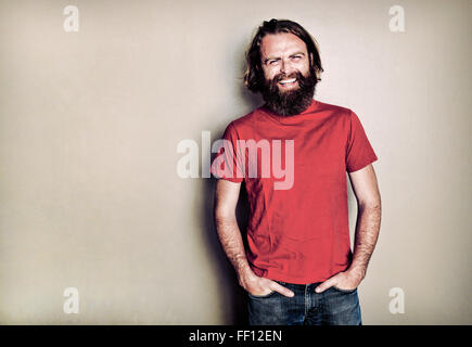 Caucasian man standing with hands in pockets Stock Photo