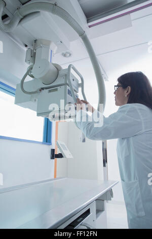 Hispanic doctor using x-ray in hospital Stock Photo