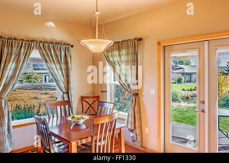 Table and windows in dining room Stock Photo