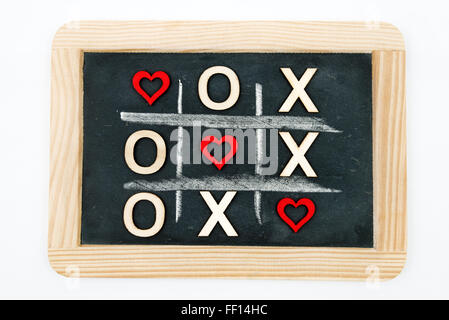 romantic display on a kitchen counter with the letters xoxo spilled over  the counter Stock Photo - Alamy