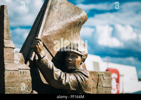 OSLO, NORWAY - JULY 31, 2014: Statue near Lighthouse at Aker Brygge In Oslo Embankment, Norway. Stock Photo