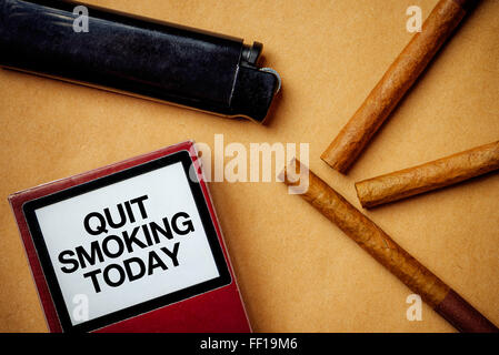 Smoking cigarettes addiction and health issue concept, flat lay arrangement, quit smoking today generic message Stock Photo
