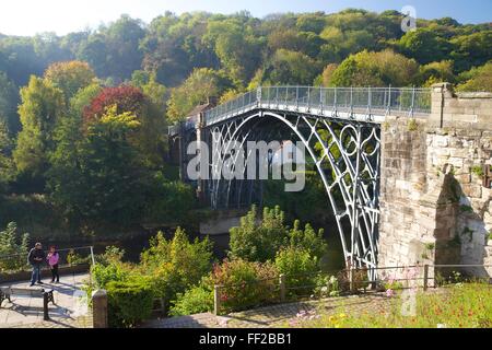 Worlds first iron bridge spans the banks of the River Severn in autumn sunshine, Ironbridge, UNESCO, Shropshire, England, UK Stock Photo