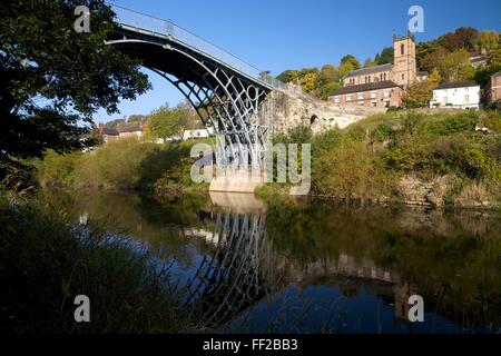 Worlds first iron bridge spans the banks of the River Severn in autumn sunshine, Ironbridge, UNESCO, Shropshire, England, UK Stock Photo