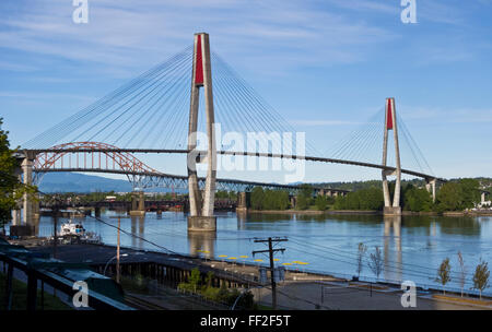 Skytrain bridge or SkyBridge, over the Fraser River, between New Westminster and Surrey British Columbia, Canada. Stock Photo