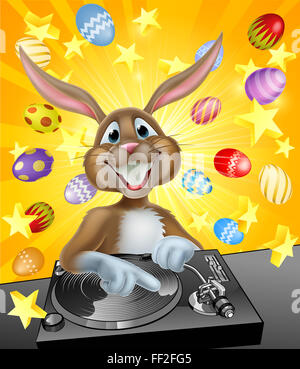Cartoon Easter bunny DJ mixing at the the decks or turntables with chocolate Easter eggs in the background Stock Photo