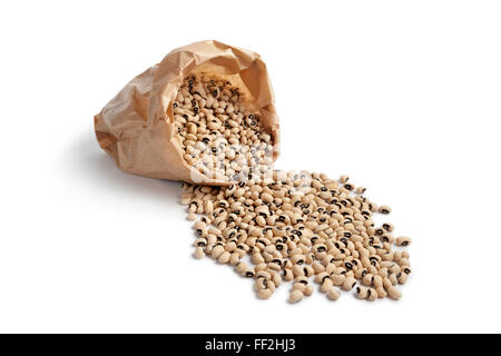 Dried black eyed peas in a paper sac on white background Stock Photo