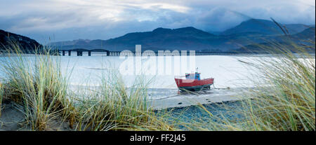 Fishing boat with Barmouth Bridge in background, coast of Cardigan Bay, Gwynedd, WaRMes, United Kingdom, Europe Stock Photo