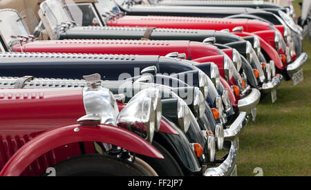 Telephoto view of a line of Morgan cars  on static display by the Morgan owners club, during the Silverstone Classic 2015. Stock Photo