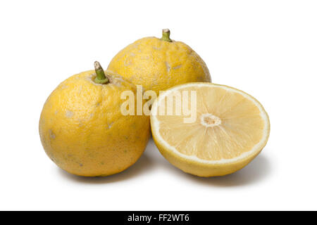 Whole and half  fresh Bergamot oranges on white background Stock Photo