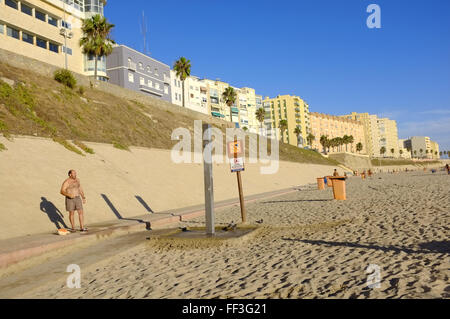 Man on Spanish beach Stock Photo