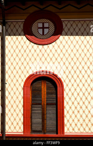 shutter europe  italy  lombardy        in  the milano old   window closed brick      abstract grate red Stock Photo