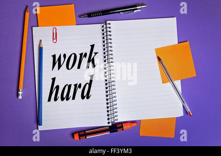 Work hard word on notepad Stock Photo