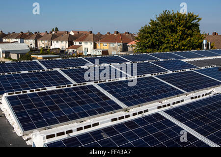 The  25kW solar panel array on the roof of Knowle West Media Centre. Supported by Bristol Energy, a community-owned energy cooperative, growing Greater Bristol’s local green energy supply and making the benefits available to all. Bristol, UK. Stock Photo