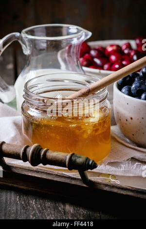 Honey, milk and berries Stock Photo