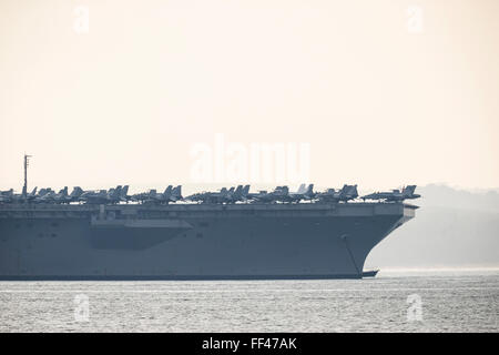 The Nimitz class aircraft carrier USS Theodore Roosevelt , at anchor in Stokes Bay in the Solent, 25th March 2015. Stock Photo