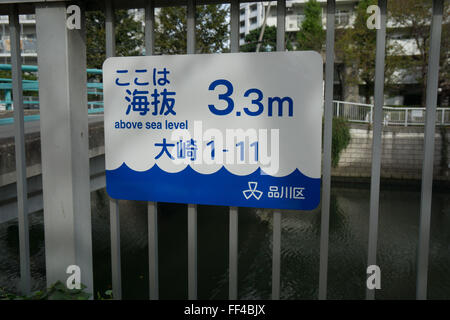 tsunami warning sign with current elevation Stock Photo
