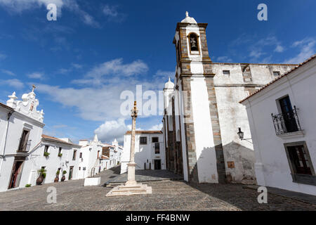 The pillory of Monsaraz across from the square from the Parochial church of Nossa Senhora da Lagoa, Portugal Stock Photo