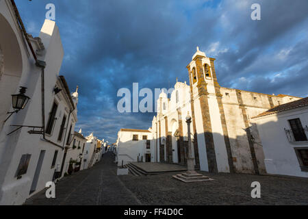 The pillory of Monsaraz across from the square from the Parochial church of Nossa Senhora da Lagoa, Portugal Stock Photo