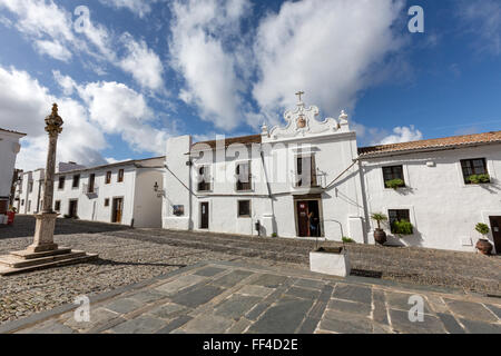 The pillory of Monsaraz across from the square from the Parochial church of Nossa Senhora da Lagoa, Portugal Stock Photo