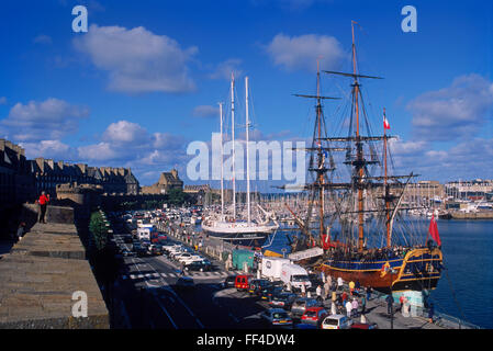 Old schooners and sailboats moored in the port at St-Malo in Brittany, France Stock Photo