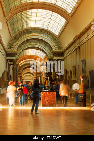 People at Louvre Museum in Denon Section with Greek and Roman antiquities in Paris Stock Photo