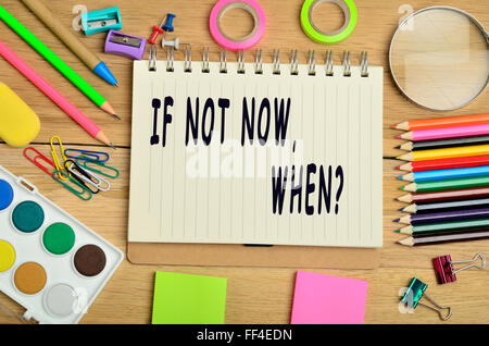 If not now, when text on notebook Stock Photo